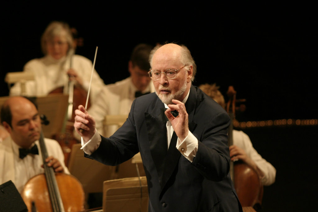 Conductor conducting in an Orchestra in Boston Massachusetts stop by with a vacation here